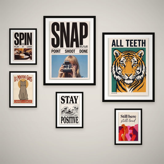Full Volume feature wall — 6 framed prints hung as a gallery wall