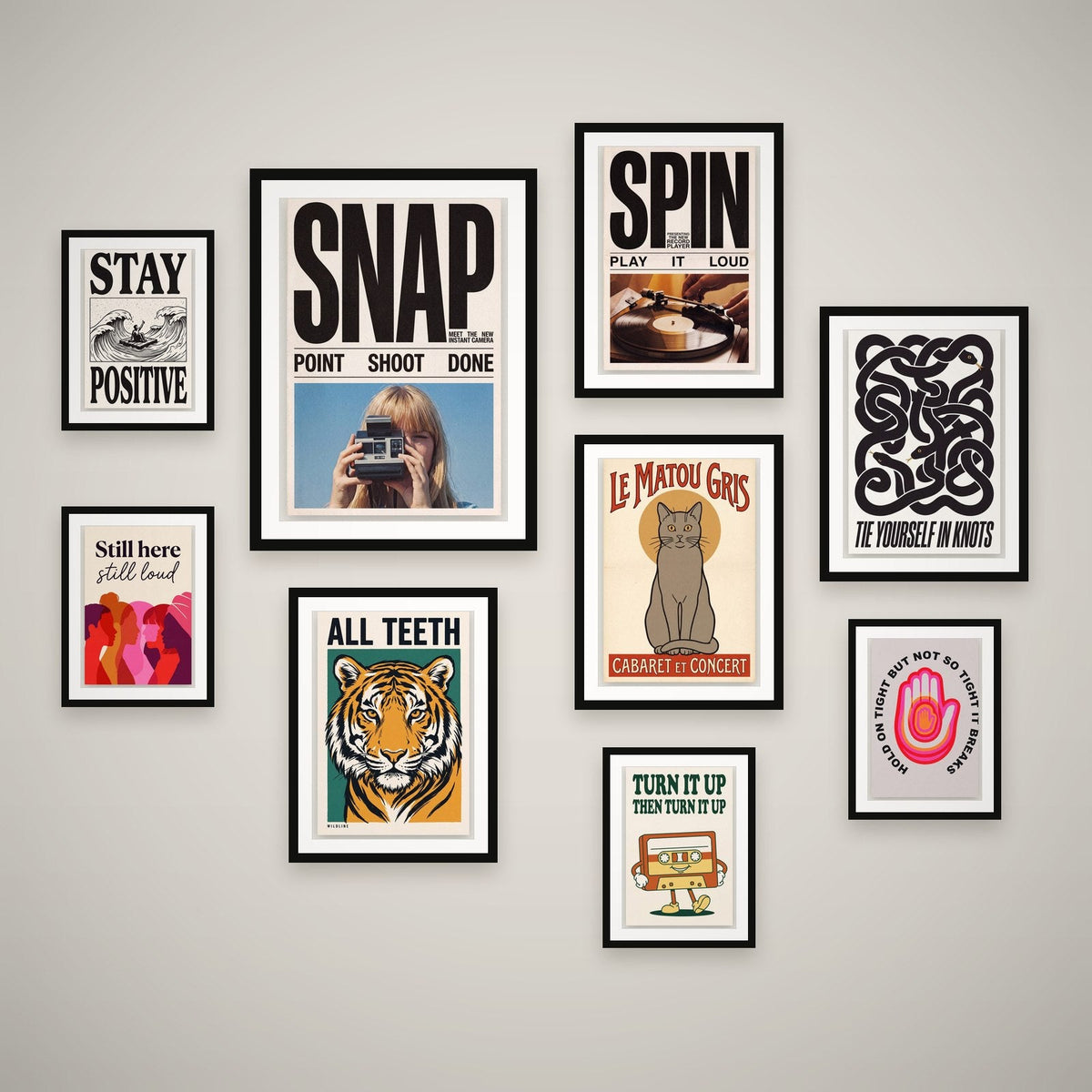 Full Volume feature wall — 9 framed prints hung as a gallery wall