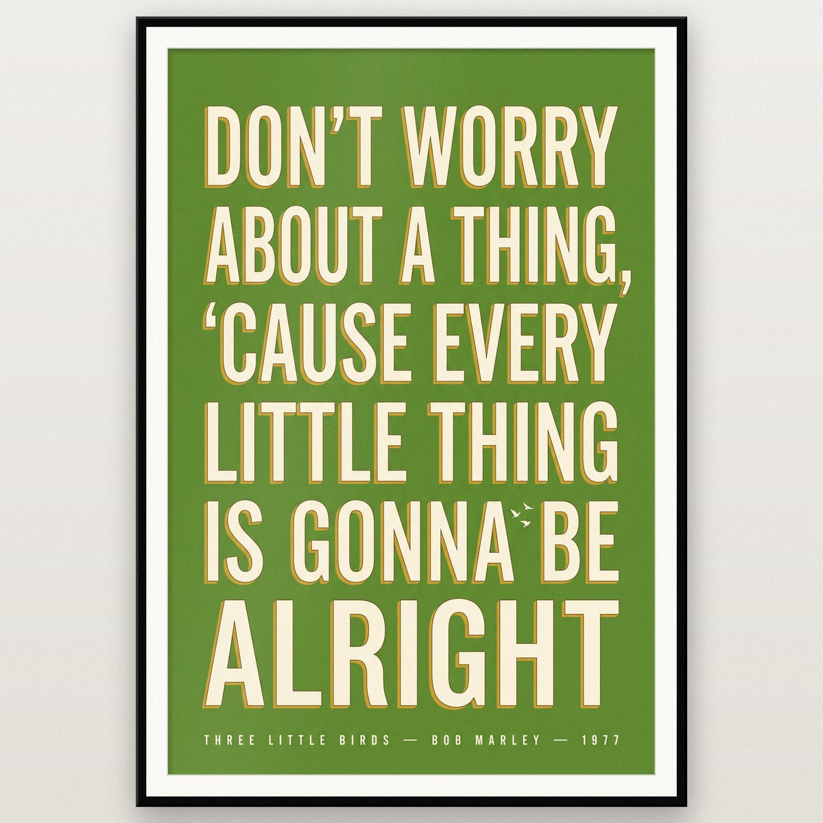 Three Little Birds Lyrics Print shown in a black frame