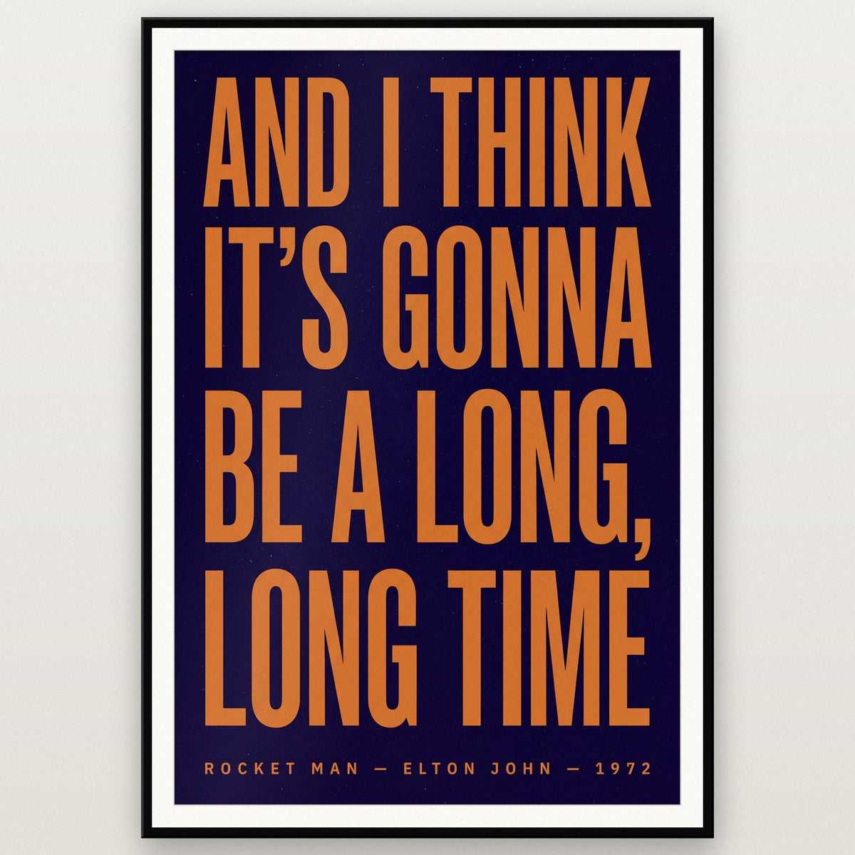 Rocket Man Lyrics Print shown in a black frame