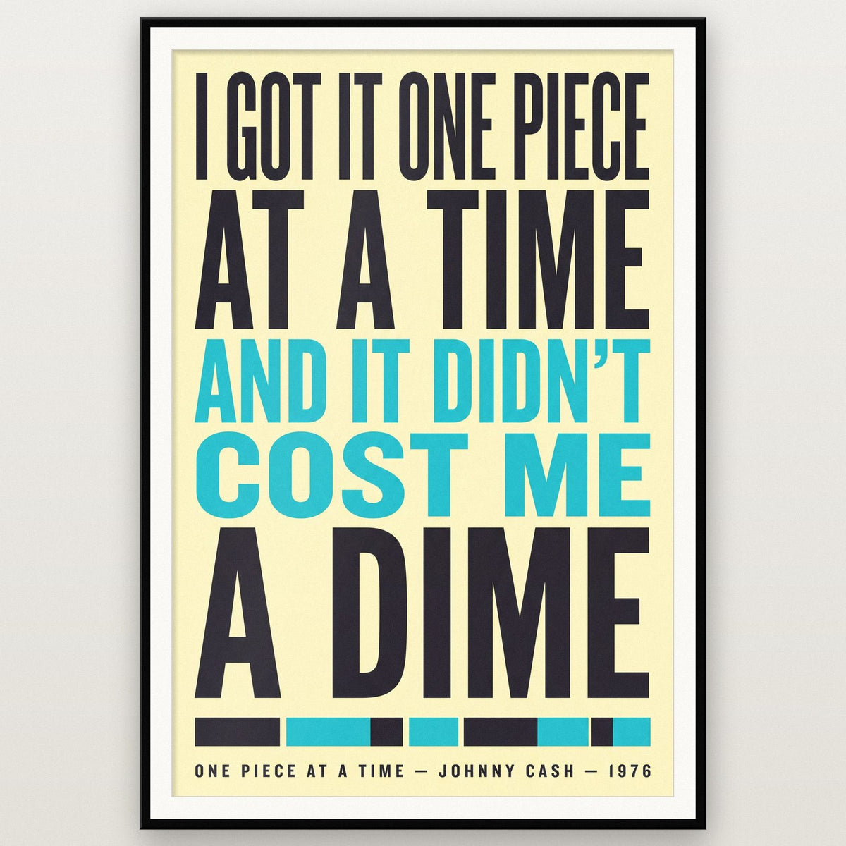 One Piece at a Time Print shown in a black frame