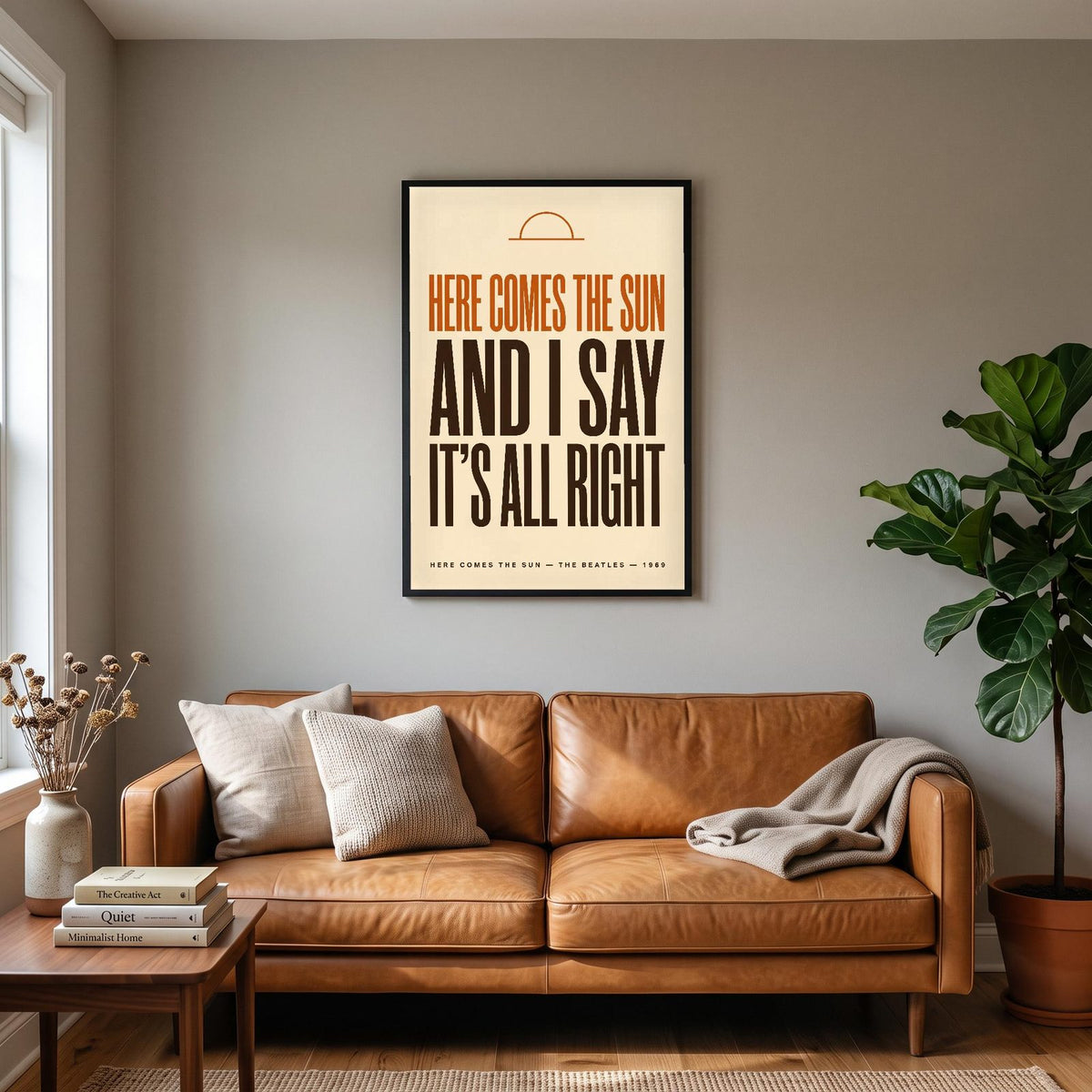 Here Comes The Sun Lyrics Print hanging on a living room wall