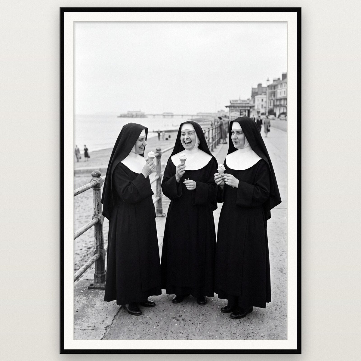 Nuns With Ice Creams shown framed on a wall