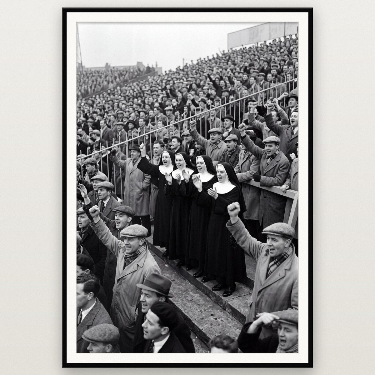 Nuns On The Terrace shown framed on a wall