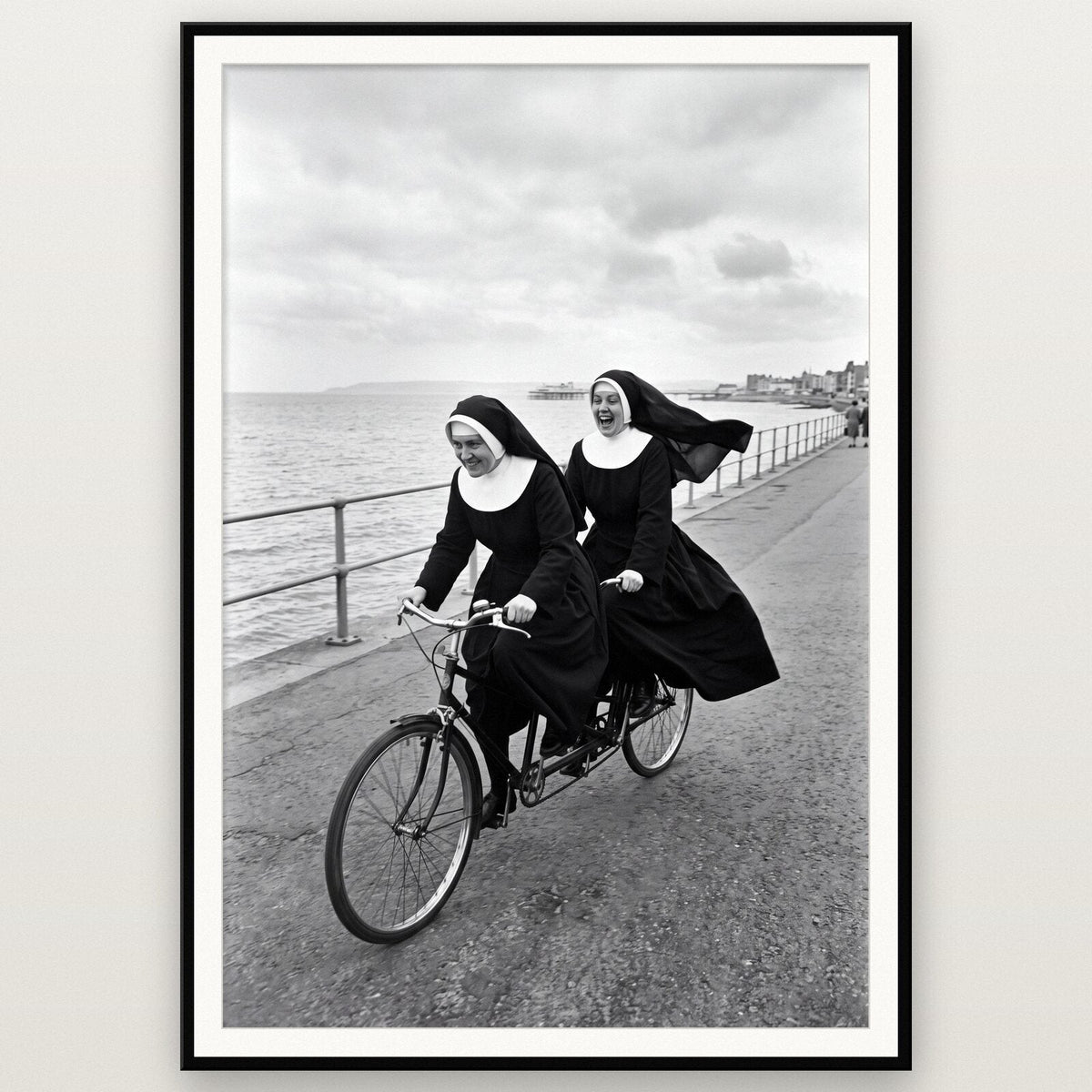 Nuns On A Tandem shown framed on a wall