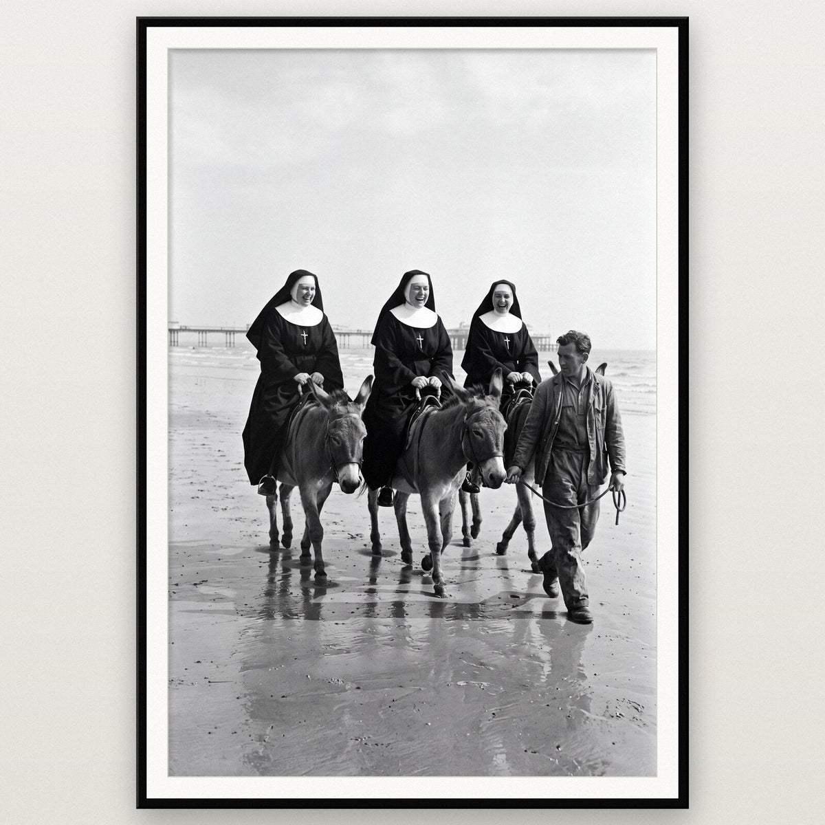 Nuns On The Donkeys shown framed on a wall